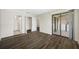 Large living room with wood floors; views of the bathroom, closet, and the washer and dryer at 4991 Puritan Cir # 522, Tampa, FL 33617