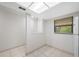 Bright, airy room with tile flooring and large window allowing ample natural light at 4991 Puritan Cir # 522, Tampa, FL 33617
