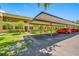 Assigned covered parking area with mature landscaping near the condo building at 4991 Puritan Cir # 522, Tampa, FL 33617