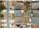 A neighborhood aerial view showcasing homes with grassy yards, pools, and close proximity to one another at 518 Greg St, Valrico, FL 33594