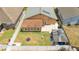 A well-kept backyard features a trampoline, a basketball hoop, and a covered patio with a car parked beneath it at 518 Greg St, Valrico, FL 33594