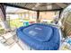 Relaxing backyard patio with cozy gazebo, comfortable seating area and inviting hot tub, perfect for outdoor enjoyment at 518 Greg St, Valrico, FL 33594