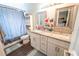 Well-lit bathroom with dual sinks, granite countertops, and a shower-tub combo at 518 Greg St, Valrico, FL 33594