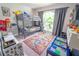 Fun room with bunkbeds, colorful decor, and a large window at 518 Greg St, Valrico, FL 33594