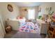 Charming bedroom with a twin bed, stylish decor, and a colorful alphabet rug at 518 Greg St, Valrico, FL 33594