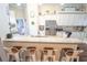Open-concept kitchen with granite countertops, stainless steel appliances, and counter seating at 518 Greg St, Valrico, FL 33594