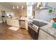 Beautiful kitchen with stainless steel appliances, granite countertops, and wood flooring at 518 Greg St, Valrico, FL 33594