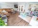 Spacious living room with a cozy sectional sofa, wood floors, and a ' play area at 518 Greg St, Valrico, FL 33594