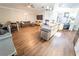 Inviting living and dining area featuring hardwood floors and an open layout to the modern kitchen at 518 Greg St, Valrico, FL 33594