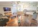 Spacious living and dining area features hardwood floors and a seamless transition to the modern kitchen at 518 Greg St, Valrico, FL 33594