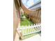 Narrow side yard with artificial turf, offering a low-maintenance outdoor space with a charming picket fence at 518 Greg St, Valrico, FL 33594