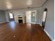 Living room featuring hardwood floors, a decorative fireplace, and arched doorways providing charm and character at 536 89Th N Ave, St Petersburg, FL 33702
