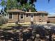 Rear exterior view of the house featuring a compact yard with the house's back entrance and siding at 536 89Th N Ave, St Petersburg, FL 33702