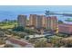 Stunning aerial view of a high-rise waterfront condo featuring tennis courts and bay access at 555 5Th Ne Ave # 424, St Petersburg, FL 33701