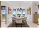 Elegant dining room with large windows offering great views, a marble table, and stylish seating at 555 5Th Ne Ave # 424, St Petersburg, FL 33701