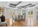 Bright dining room with marble floors, modern table, and French doors leading to outdoor space at 555 5Th Ne Ave # 424, St Petersburg, FL 33701