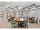 Bright game room features multiple tables, chairs, and shutters on windows at 555 5Th Ne Ave # 424, St Petersburg, FL 33701