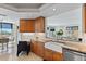 Bright kitchen boasts granite countertops, a farmhouse sink, and stainless steel appliances, offering a functional and stylish space at 555 5Th Ne Ave # 424, St Petersburg, FL 33701