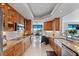 Gourmet kitchen with custom wood cabinets, granite countertops, and stainless steel appliances at 555 5Th Ne Ave # 424, St Petersburg, FL 33701
