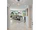 Bright living room features a neutral palette, tiled floor, and floor to ceiling windows at 555 5Th Ne Ave # 424, St Petersburg, FL 33701
