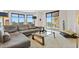 Comfortable living room with a large sofa, bright windows, and contemporary decor at 555 5Th Ne Ave # 424, St Petersburg, FL 33701