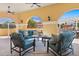 Inviting covered patio featuring stylish seating, ceiling fans and views of lush landscaping and beautiful community features at 555 5Th Ne Ave # 424, St Petersburg, FL 33701