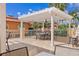 Expansive community patio features a white pergola, outdoor dining and stunning views, creating a perfect entertainment space at 555 5Th Ne Ave # 424, St Petersburg, FL 33701