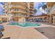 Beautiful community pool surrounded by comfortable loungers and lush landscaping, creating a relaxing and resort-like atmosphere at 555 5Th Ne Ave # 424, St Petersburg, FL 33701