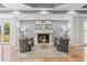 Comfortable seating area with fireplace and plush chairs create an inviting atmosphere at 555 5Th Ne Ave # 424, St Petersburg, FL 33701
