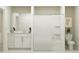 A white bathroom with shower/bathtub, white sink, and toilet creating a clean and modern space at 5623 Red Kite Dr, Wimauma, FL 33598