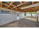 Enclosed back patio with a wooden deck and an unfinished roof at 5660 Hobson Ne St, St Petersburg, FL 33703