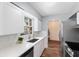 Bright kitchen featuring white countertops, stainless steel appliances, and updated fixtures at 5660 Hobson Ne St, St Petersburg, FL 33703