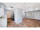 Modern kitchen featuring white cabinetry, stainless steel appliances, and terracotta tile flooring at 5660 Hobson Ne St, St Petersburg, FL 33703