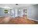 Spacious living room featuring terracotta floors and a view into the renovated kitchen at 5660 Hobson Ne St, St Petersburg, FL 33703