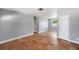 Bright, airy living room with terracotta floors, freshly painted walls and ample natural light at 5660 Hobson Ne St, St Petersburg, FL 33703