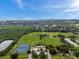 Full sports park with tennis courts and soccer fields near a mangrove and distant city skyline at 5660 Hobson Ne St, St Petersburg, FL 33703