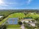Scenic view of a community sports complex with tennis courts and sports fields near a lush, green mangrove at 5660 Hobson Ne St, St Petersburg, FL 33703