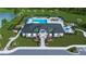 Beautiful community center showcasing a pool, lounge chairs, well-maintained landscaping, and the American flag at 5703 Silverside Pine Ct, Lakewood Ranch, FL 34211