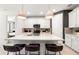Modern kitchen with stainless appliances, quartz countertops and a center island at 5703 Silverside Pine Ct, Lakewood Ranch, FL 34211