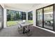 Screened-in patio providing an ideal spot for outdoor dining and relaxation with views of the landscaped yard at 5703 Silverside Pine Ct, Lakewood Ranch, FL 34211
