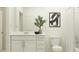Bright bathroom featuring a modern vanity, framed art, and shower with tub at 5709 Yellow Hornbill Ave, Wimauma, FL 33598