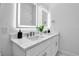 Bathroom featuring double vanity with sleek countertops, modern lighting, and minimalist design at 600 3Rd S Ave # 201, St Petersburg, FL 33701