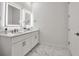 Stylish bathroom showcasing double sinks, modern vanity, and chic, illuminated mirrors at 600 3Rd S Ave # 201, St Petersburg, FL 33701