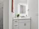 Modern bathroom featuring a sleek vanity, backlit mirror, and contemporary fixtures for a stylish, functional space at 600 3Rd S Ave # 201, St Petersburg, FL 33701