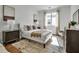 Cozy bedroom with a comfortable bed, stylish decor, and ample natural light from the window at 600 3Rd S Ave # 201, St Petersburg, FL 33701