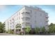 Contemporary apartment building with multiple balconies, well-maintained landscaping, and a modern architectural design at 600 3Rd S Ave # 201, St Petersburg, FL 33701