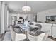 Dining table near a kitchen and living area, with modern appliances and comfortable seating at 600 3Rd S Ave # 201, St Petersburg, FL 33701