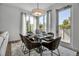 Bright dining room features modern table setting, stylish chairs, and natural light from large windows at 600 3Rd S Ave # 201, St Petersburg, FL 33701