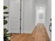 Bright hallway with wood floors, white walls, and a minimalist aesthetic, creating a clean and welcoming entrance at 600 3Rd S Ave # 201, St Petersburg, FL 33701