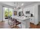 Beautiful kitchen featuring a large island with bar seating, modern appliances, and stylish pendant lighting at 600 3Rd S Ave # 201, St Petersburg, FL 33701